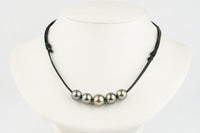 Necklace with pink Tahitian pearls on a leather cord