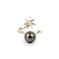 Silver ring with a black pearl and floral design on a white background