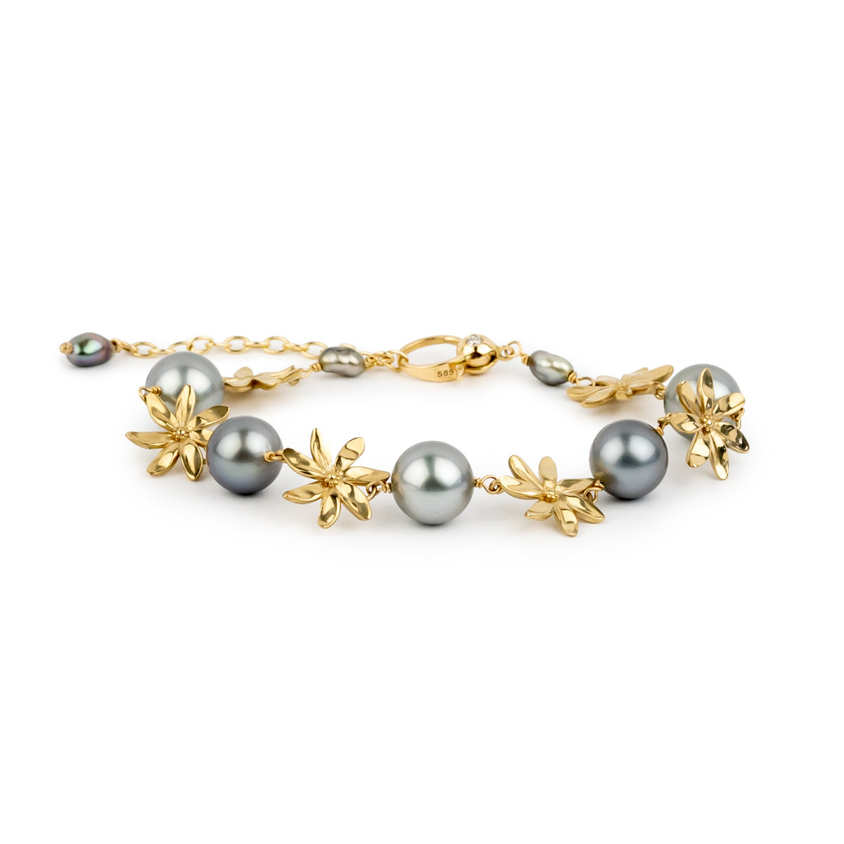 Gold bracelet with gray pearls on a white background